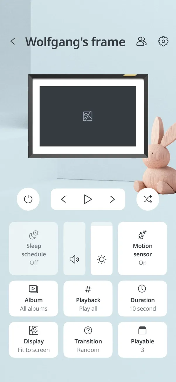 The control screen for a frame in the Nixplay app, with buttons for playback, volume, brightness, sleep schedule, motion sensor, album, duration and transition